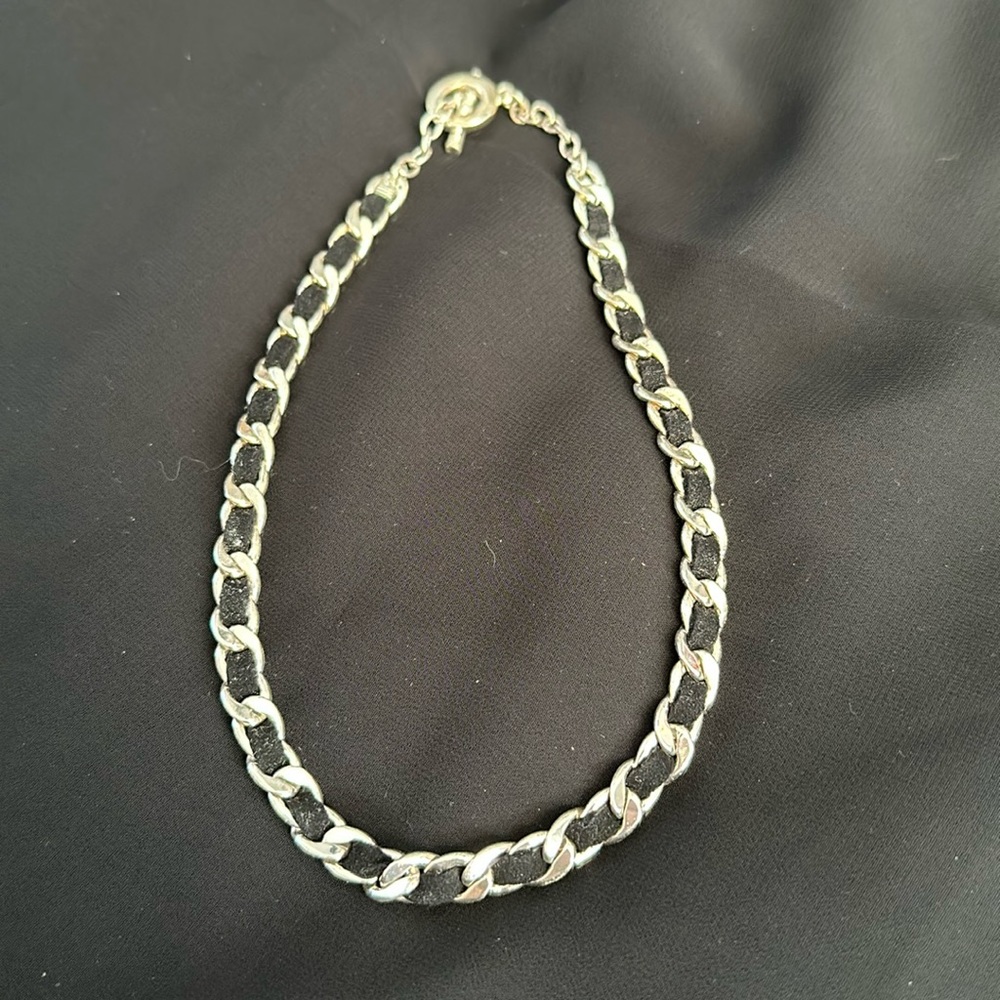 Adjustable silver tone necklace.